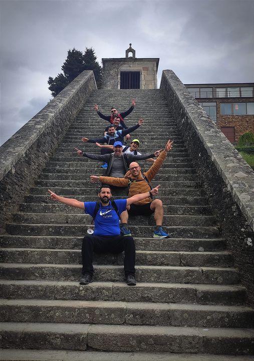 Group photo on stairs at Camino de Compostela